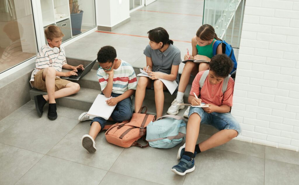 Students Sitting on Stairs