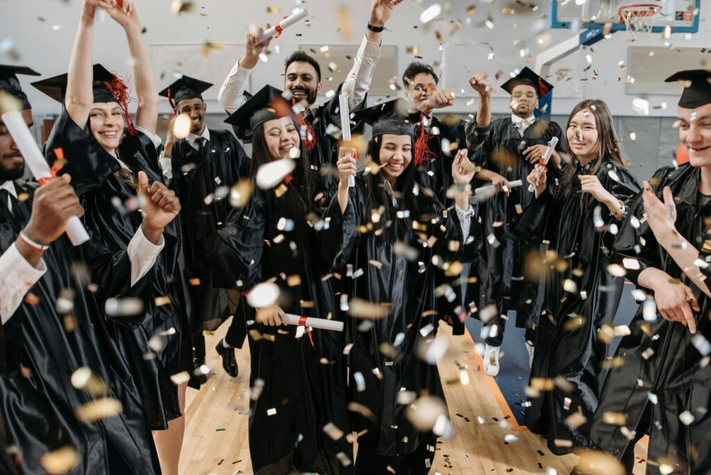 Photo of Fresh Graduates Celebrating in Gym
